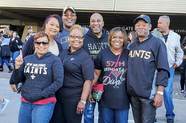 Frank Thompson (back center) attended a New Orleans Saints game in the fall during a trip for a family wedding. He was killed in a crash Monday night in Cobb County. (Family photo)