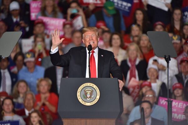 President Donald Trump led thousands of Georgians in a rally Sunday in a cramped airport hangar outside Macon to support Republican candidate for Georgia governor Brian Kemp.