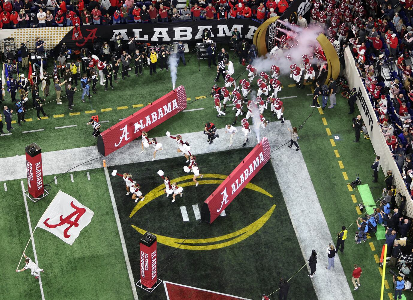 Alabama takes the field at the 2022 College Football Playoff National Championship  between the Georgia Bulldogs and the Alabama Crimson Tide at Lucas Oil Stadium in Indianapolis on Monday, January 10, 2022.   Bob Andres / robert.andres@ajc.com