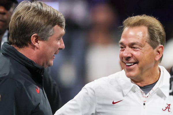 Georgia Bulldogs head coach Kirby Smart and Alabama Crimson Tide head coach Nick Saban get together before the SEC Championship football game at the Mercedes-Benz Stadium in Atlanta, on Saturday, December 2, 2023. (Jason Getz / Jason.Getz@ajc.com)