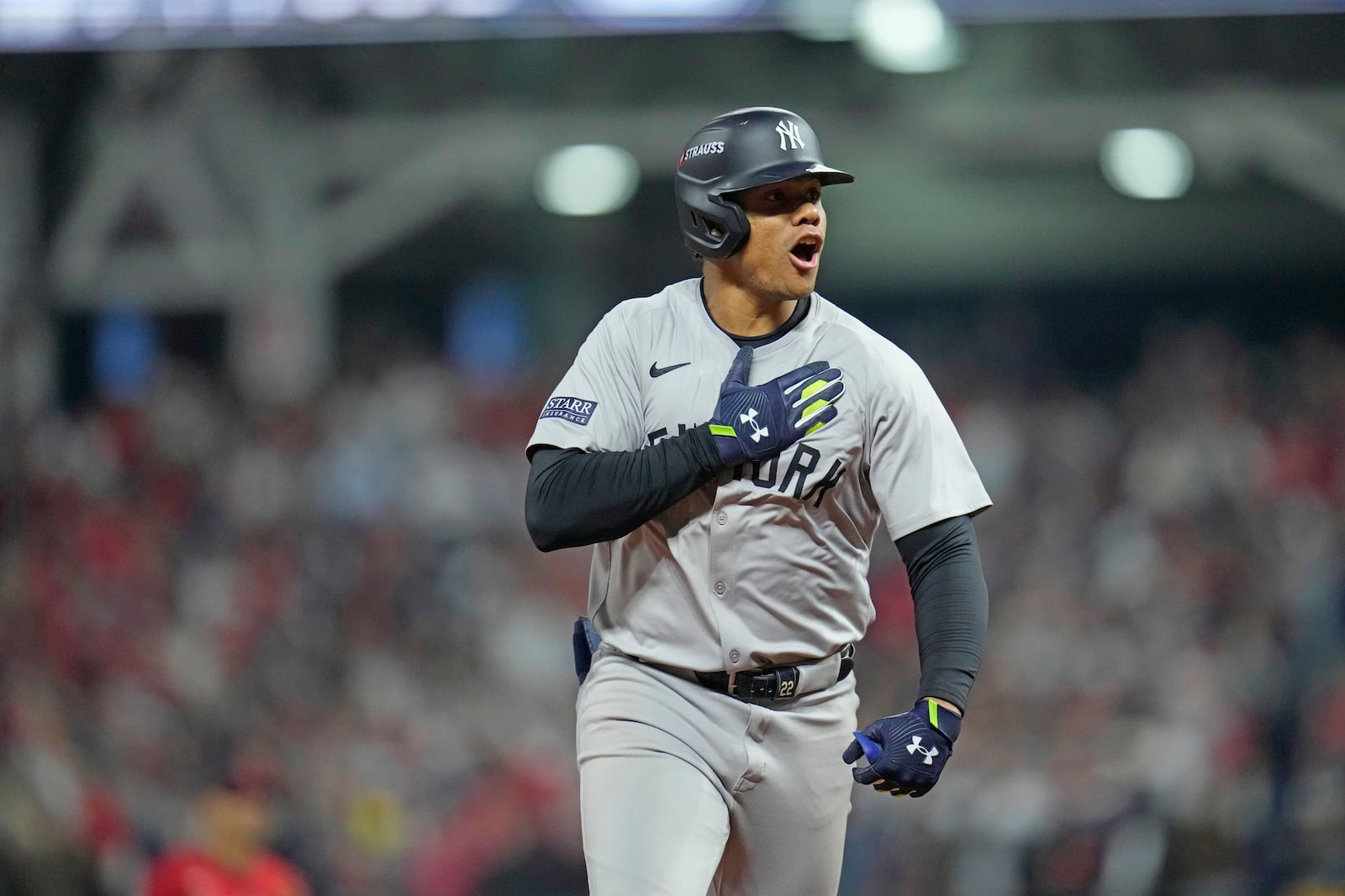 New York Yankees' Juan Soto celebrates after hitting a three-run home run against the Cleveland Guardians during the 10th inning in Game 5 of the baseball AL Championship Series Saturday, Oct. 19, 2024, in Cleveland. The Yankees won 5-2 to advance to the World Series. (AP Photo/Sue Ogrocki)