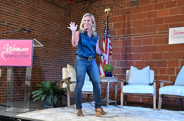 U.S. Rep. Marjorie Taylor Greene leaves the stage after she spoke during a town hall meeting at The Lewis Loft in Rome on Tuesday, July 13, 2021. (Hyosub Shin / Hyosub.Shin@ajc.com)