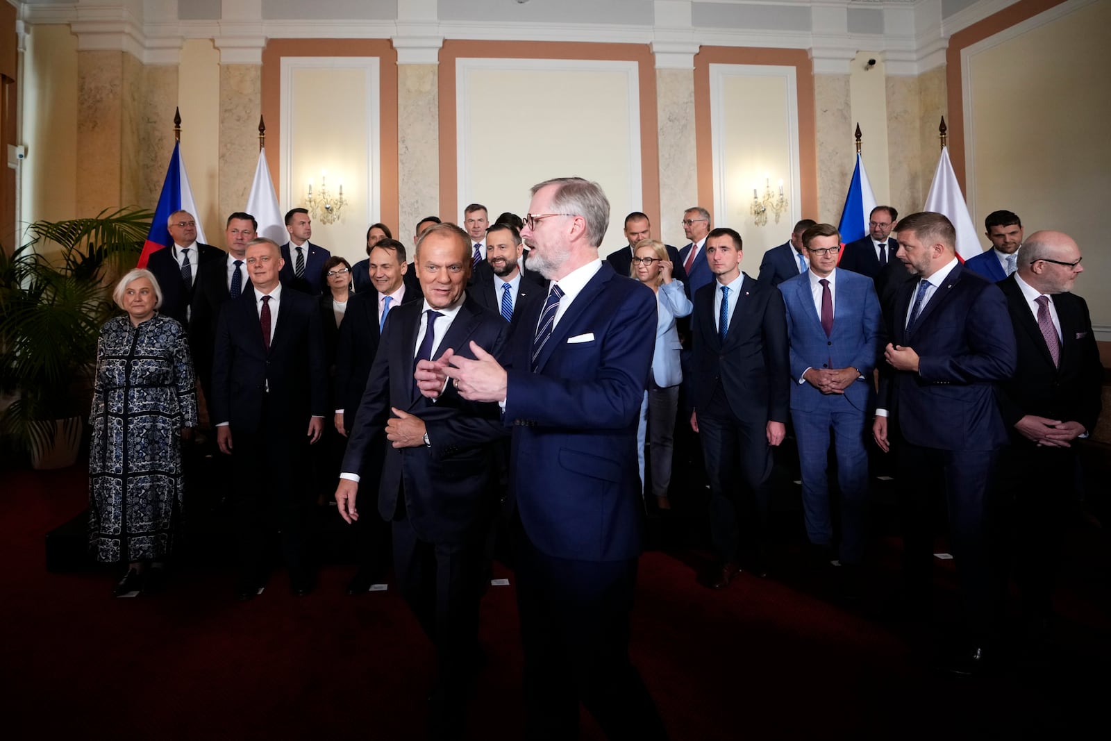 Czech Republic's Prime Minister Petr Fiala, right, welcomes his Poland's counterpart Donald Tusk as their governments meet in Prague, Czech Republic, Wednesday, Oct. 9, 2024. (AP Photo/Petr David Josek)