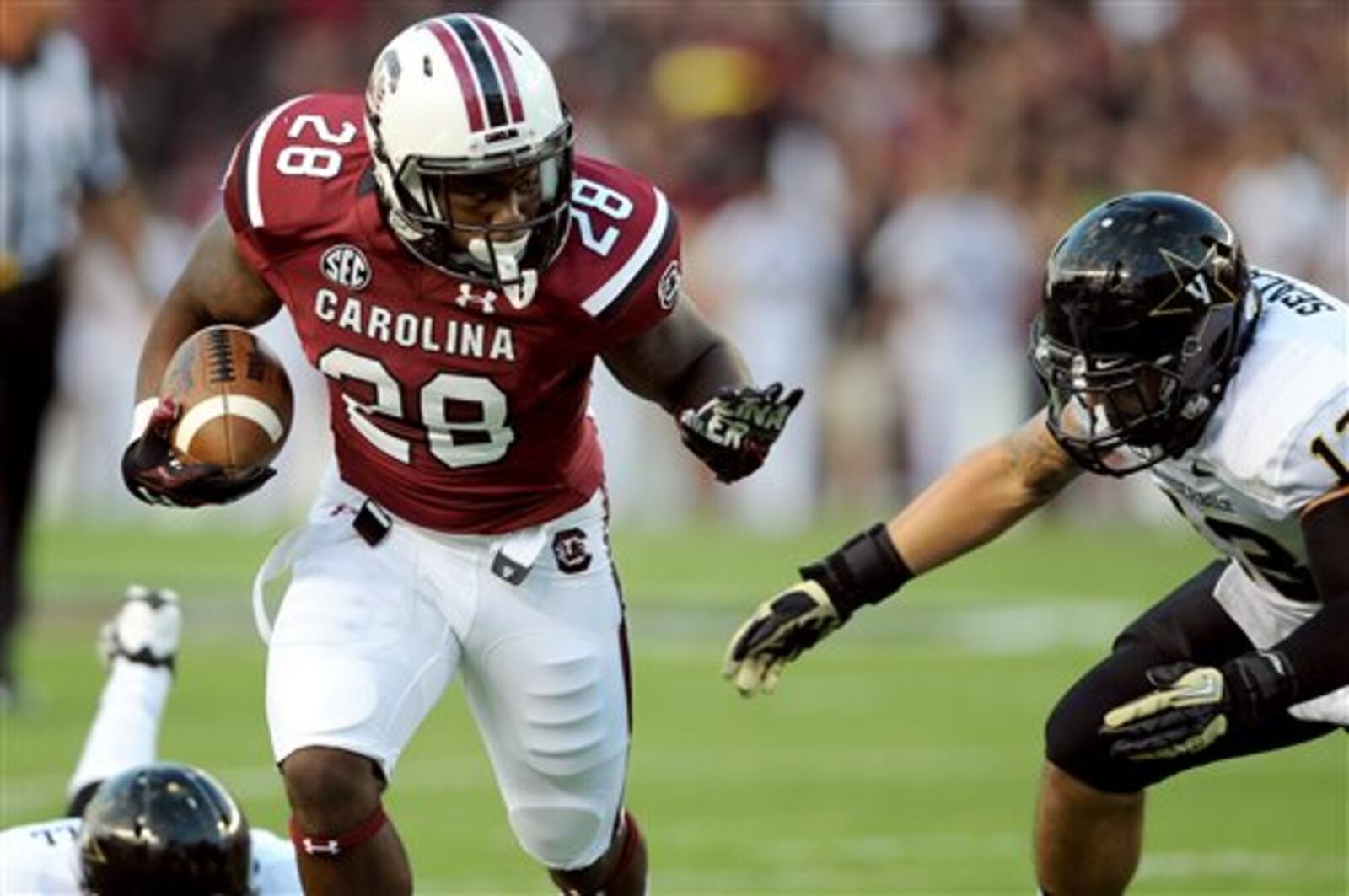 South Carolina running back Mike Davis (28) out runs Vanderbilt Commodores linebacker Jake Sealand (13) during a run in the first half of an NCAA college football game, Saturday, Sept. 14, 2013 in Columbia, S.C. (AP Photo/Stephen Morton) South Carolina running back Mike Davis (28) out runs Vanderbilt Commodores linebacker Jake Sealand (13) during a run in the first half of an NCAA college football game, Saturday, Sept. 14, 2013 in Columbia, S.C. He played at Stephenson High. (AP Photo/Stephen Morton)