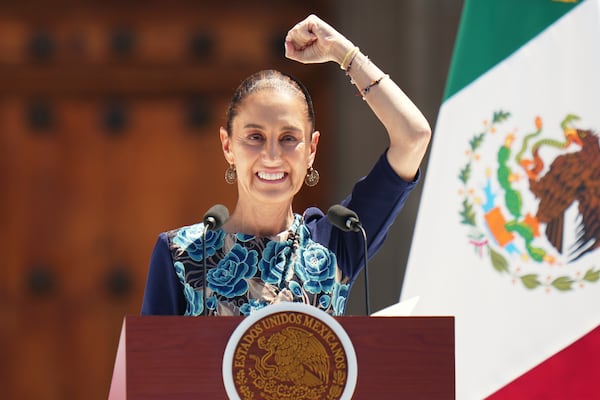 President Claudia Sheinbaum addresses supporters at a rally she convened to welcome U.S. President Donald Trump's decision to postpone tariffs on Mexican goods for one month at the Zocalo, Mexico City's main square, Sunday, March 9, 2025. (AP Photo/Eduardo Verdugo)