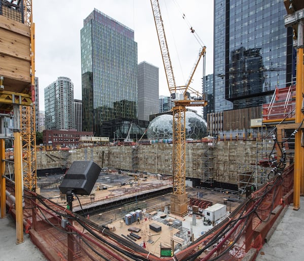 This angle looks across the foundation of another Amazon building being built near Amazon’s Doppler building at left, and its Spheres and Day 1 building at right, in downtown Seattle, Wash. On Thursday, Amazon said it wants to build a second North American headquarters to rival its Seattle base of operations. (Steve Ringman/Seattle Times/TNS)