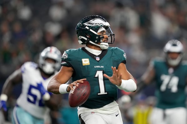 Philadelphia Eagles' Jalen Hurts prepares to throw a pass in the second half of an NFL football game against the Dallas Cowboys in Arlington, Texas, Sunday, Nov. 10, 2024. (AP Photo/Jeffrey McWhorter)