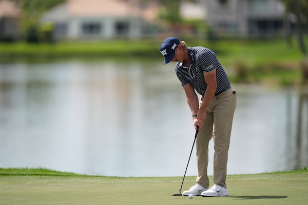 Jake Knapp putts on the 18th hole on his way to finishing with a 59 in his first round at the Cognizant Classic golf tournament, Thursday, Feb. 27, 2025, in Palm Beach Gardens, Fla. (AP Photo/Rebecca Blackwell)