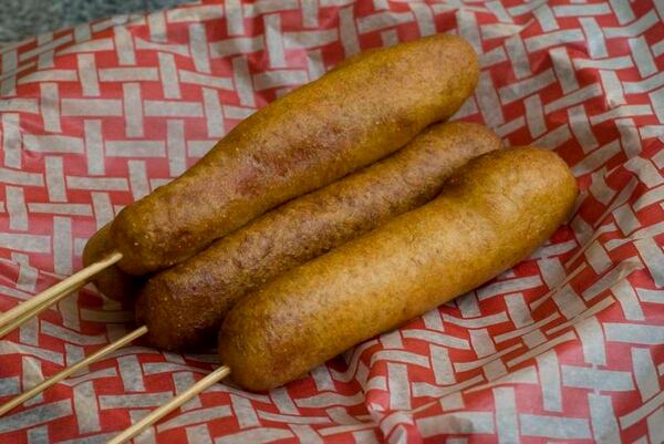 Corn dogs are a staple of concession stands at county fairs. (Associated Press)