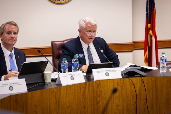 (Left to right) Republican state Sens. John Albers of Roswell and state Sen. Randy Robertson of Cataula, listen to testimony at a Department of Corrections Facilities Study Committee meeting in August.