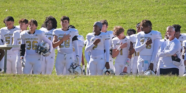 Apalachee players say the pledge before the game. The high school team returned to the field against Clarke Central on Saturday, Sept. 28, 2024. It was Apalachee High's first game since the mass shooting at Apalachee in Georgia on Sept. 4.

 Nell Carroll for The Atlanta Journal-Constitution