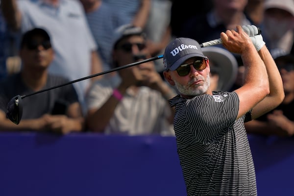 Paul Waring of England hits off the first tee during the first round of World Tour Golf Championship in Dubai, United Arab Emirates, Thursday, Nov. 14, 2024. (AP Photo/Altaf Qadri)