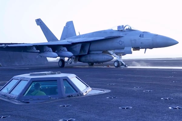 This image taken from video provided by the U.S. Navy shows an aircraft launching from a carrier in an undisclosed location before airstrikes in Sanaa, Yemen, Saturday, March 15, 2025. (U.S. Navy via AP)