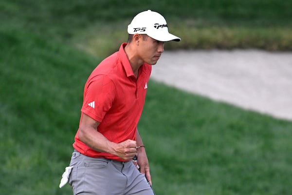 Collin Morikawa pumps his fist after making a putt for birdie and the lead on the 18th green during the third round of the Arnold Palmer Invitational at Bay Hill golf tournament, Saturday, March 8, 2025, in Orlando, Fla. (AP Photo/Phelan M. Ebenhack)