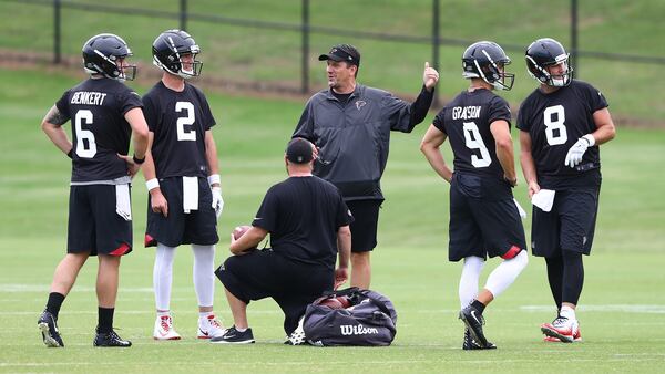 Atlanta Falcons quarterbacks coach Greg Knapp works with quarterbacks Kurt Benkert (from left), Matt Ryan, Garrett Grayson, and Matt Schaub during team practice on Tuesday, June 5, 2018, in Flowery Branch.