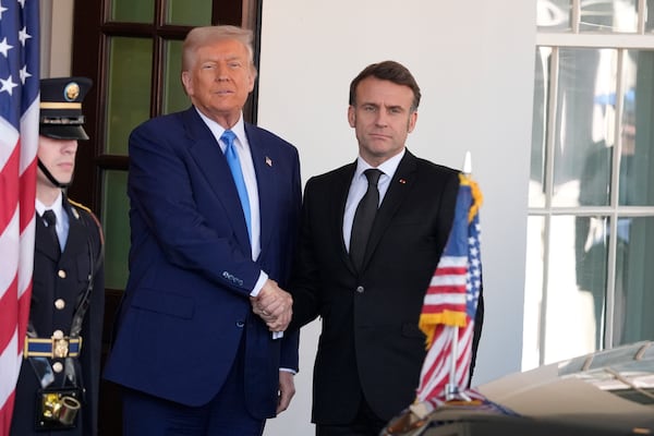 President Donald Trump, left, greets France's President Emmanuel Macron before a news conference at the White House, Monday, Feb. 24, 2025, in Washington. (AP Photo/Manuel Balce Ceneta)