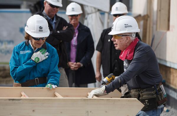 Former President Jimmy Carter and his wife Rosalynn help build homes for Habitat for Humanity in Edmonton Alberta, Tuesday July 11, 2017. An earlier Jimmy & Rosalynn Carter Work Project built homes in Katrina-ravaged regions of the South in 2008. (Jason Franson/The Canadian Press via AP)