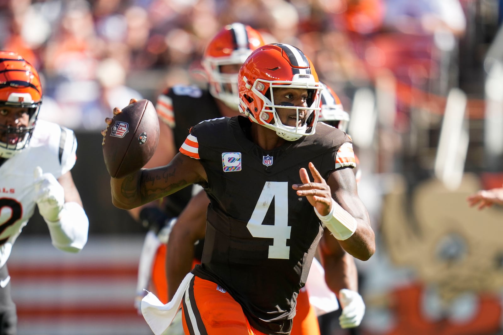 Cleveland Browns quarterback Deshaun Watson (4) looks to pass in the first half of an NFL football game against the Cincinnati Bengals, Sunday, Oct. 20, 2024, in Cleveland. (AP Photo/Sue Ogrocki)