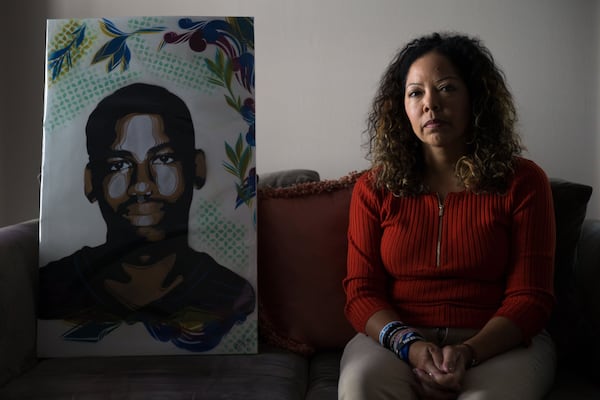 Congresswoman Lucy McBath with a portrait of her son Jordan Davis, who at age 17 was fatally shot outside a Florida convenience store in 2012.  BRANDEN CAMP/SPECIAL