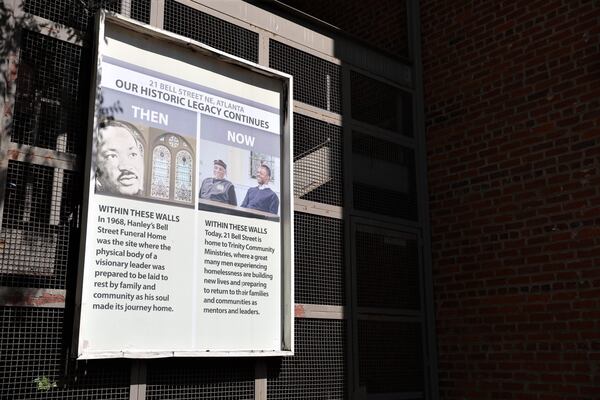 A placard memorializing the civil rights history of the Hanley building features images of both Dr. Martin Luther King, Jr. and Leonard "Mzee" Tate.