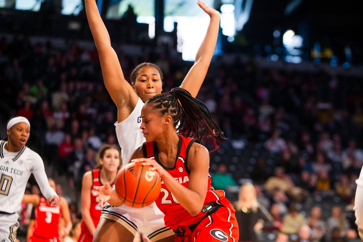 Georgia Tech's Carmyn Harrison defends against UGA's Jordan Isaacs on Sunday in Atlanta. (CHRISTINA MATACOTTA / FOR THE ATLANTA JOURNAL-CONSTITUTION)