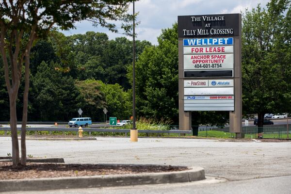 The PawStand's sign can be seen on a sign for the shopping center in Doraville. (Casey Sykes for The Atlanta Journal-Constitution)