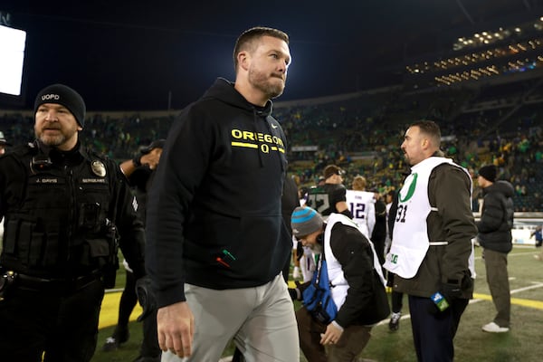 Oregon head coach Dan Lanning leaves the field after a win over Washington in an NCAA college football game, Saturday, Nov. 30, 2024, in Eugene, Ore. (AP Photo/Lydia Ely)