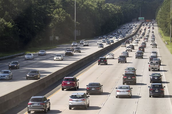 Automobiles travel along Georgia 400, Tuesday, July 23, 2019. Cities along Ga. 400 are talking about petitioning the Georgia Department of Transporation to have a say in how the new highway is being designed as part of the ongoing widening project. (Alyssa Pointer/alyssa.pointer@ajc.com)