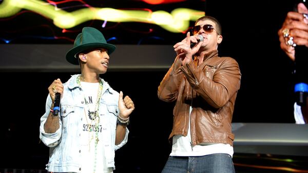 Pharrell Williams and Robin Thicke perform. They both have to pay the family of Marvin Gaye over copyright infringement connected to their song, "Blurred Lines."