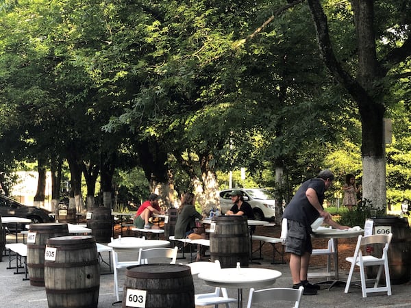 Wrecking Bar Brewpub offers outdoor “barrel service,” meaning the order is placed on a barrel by the table as a distancing measure. 
Courtesy of Wendell Brock