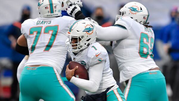 Miami Dolphins quarterback Tua Tagovailoa (1) runs the ball in the second half against the Buffalo Bills, Sunday, Jan. 3, 2021, in Orchard Park, N.Y. (Adrian Kraus/AP)