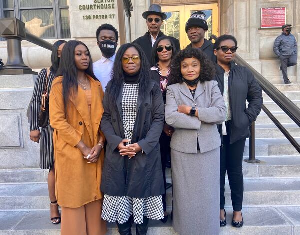 Jamarion Robinson's family members speak with reporters Tuesday outside the Fulton County courthouse.