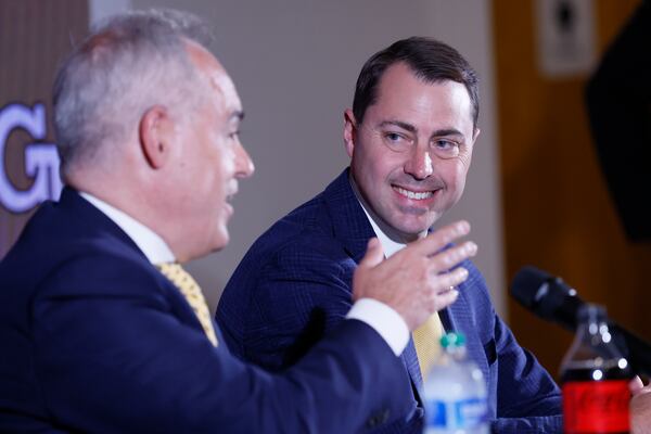 The new Georgia Tech Athletic Director, J Batt, observes President Angel Cabrera speak during a press conference where he was introduced to press members on Monday, October 17, 2022.Miguel Martinez / miguel.martinezjimenez@ajc.com