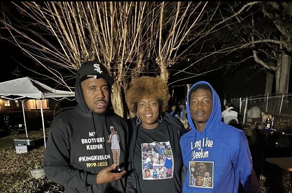 Kendall Dennis, 33, Kenya Jackson, 36, and Ronnie Tate Jr., 25, wear shirts dedicated to their sibling Keelon Tate.