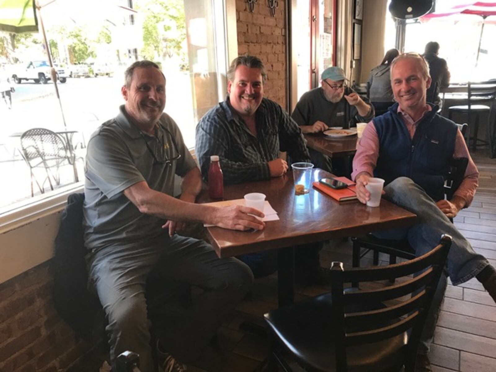 Glover Park Brewery Sam Rambo, left, and Hank DuPre, far right, sit on either side of Kevin McNerney, co-founder of SweetWater Brewing and a beer adviser to the new Marietta brewery. (Provided by Glover Park Brewery)