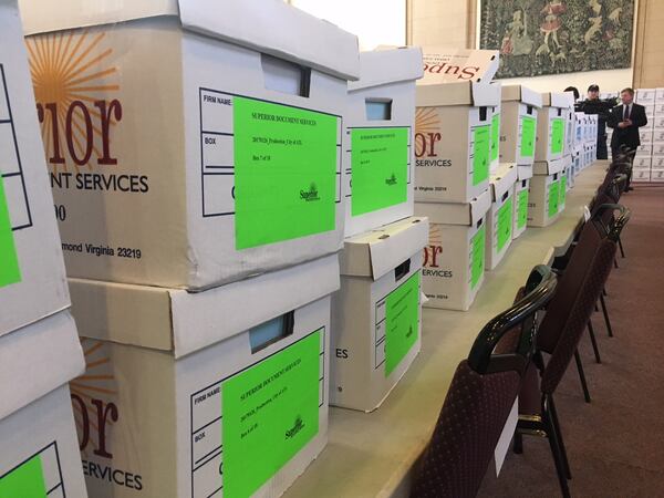 Mayor Kasim Reed presented boxes containing more than 1.4 million pages of public records.