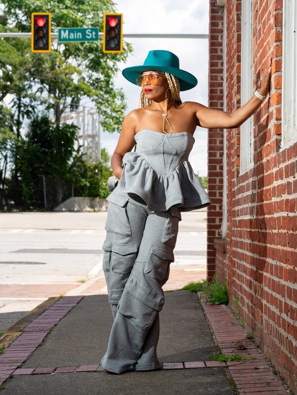 Danielle Miller poses for a portrait in downtown East Point, GA on Monday, August 5, 2024. (Seeger Gray / AJC)