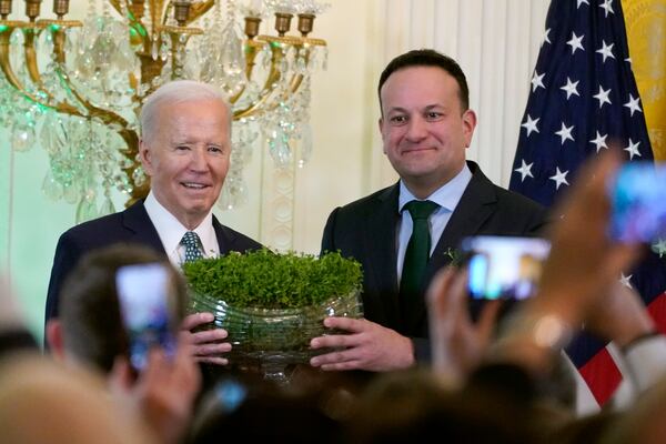 FILE - Ireland's Prime Minister Leo Varadkar, right, presents President Joe Biden with a bowl of Shamrocks during a St. Patrick's Day reception in the East Room of the White House, Sunday, March 17, 2024. (AP Photo/Stephanie Scarbrough, File)