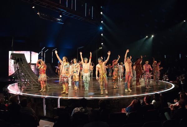 Artists wave to fans during from Cirque du Soleil Volta at Atlantic Station on Thursday, December 12, 2019. Behind-the-scenes of Cirque, with an emphasis on the musicians who are a visible part of the show. The storyline revolves around Waz, a young man in danger of becoming one of the Greys, a group of conforming city dwellers who are glued to their cellphones and locked into boring routines. In a bid for love and attention, Waz becomes enamored with celebrity culture and competes on the Mr. Wow Show. But things end badly when Waz is harshly judged for the thing that makes him special. Thanks to the Freespirits, escaped Greys who enjoy the freedom of being true to themselves, Waz learns to accept himself for who he is. (Hyosub Shin / Hyosub.Shin@ajc.com)