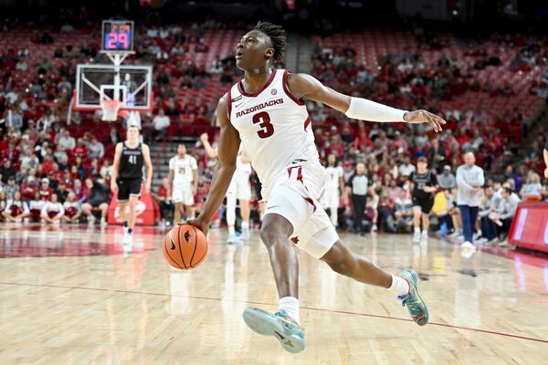 Arkansas forward Adou Thiero (3) drives to the hoop on a fast break against Lipscomb during the second half of an NCAA college basketball game Wednesday, Nov. 6, 2024, in Fayetteville, Ark. (AP Photo/Michael Woods)