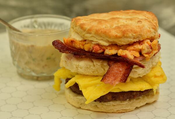 The Hot Mess- a biscuit sandwich composed of egg, sausage, bacon, pimento cheese and a side of sausage gravy at Flora and Flour (Chris Hunt/Special)