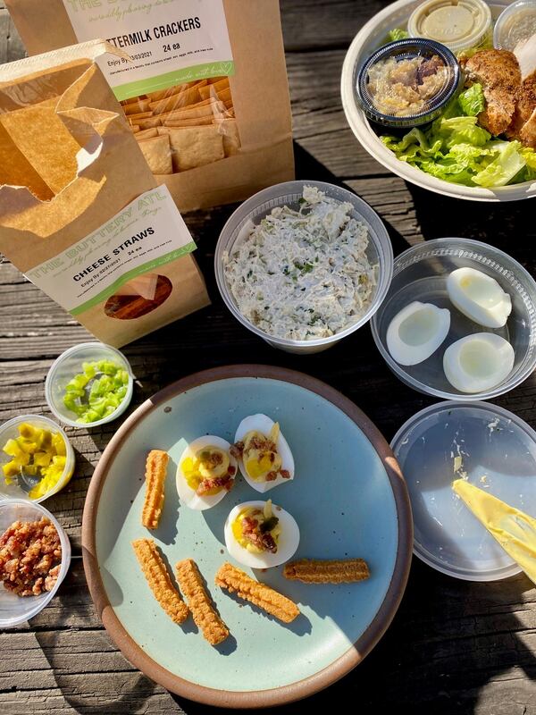 The Buttery is a swell spot for picking up picnic fixings, such as chicken salad, cheese straws, buttermilk crackers, a Caesar with chicken and a deviled egg kit. Wendell Brock for The Atlanta Journal-Constitution