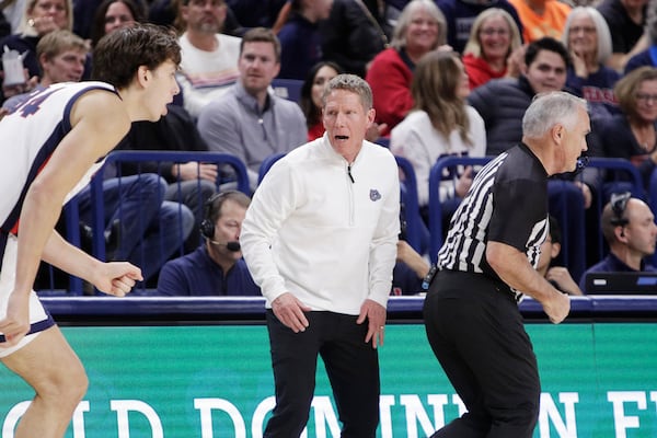 Gonzaga head coach Mark Few, center, reacts during the first half of an NCAA college basketball game against UMass-Lowell, Friday, Nov. 15, 2024, in Spokane, Wash. (AP Photo/Young Kwak)