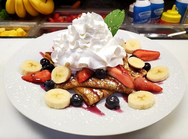 Peachtree Cafe, in downtown Lawrenceville, offers a variety of crepes, including the USA Sweet Cream, with house-made sweet cream cheese topped with fresh fruit and whipped cream. CONTRIBUTED BY PEACHTREE CAFE