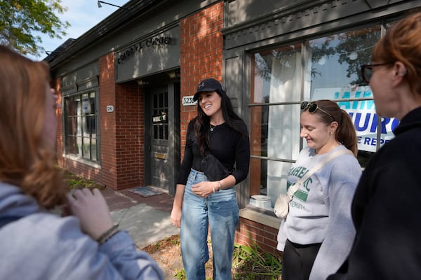 Democratic state Rep. Jaime Churches meets with volunteers, Friday, Oct. 11, 2024, in Trenton, Mich. (AP Photo/Carlos Osorio)