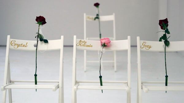 A memorial for the victims of the shooting at Sutherland Springs First Baptist Church includes 26 white chairs, each painted with a cross and and rose, is displayed in the church Sunday, Nov. 12, 2017, in Sutherland Springs, Texas. A man opened fire inside the church in the small South Texas community last week, killing more than two dozen. (AP Photo/Eric Gay)