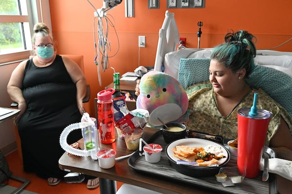 COVID-19 patient Emmaleine O’Neill, 16, talks to her mother Stephanie O’Neill after Emma was given permission to leave Memorial Health’s Dwaine & Cynthia Willett Children’s Hospital of Savannah. (Hyosub Shin / Hyosub.Shin@ajc.com)