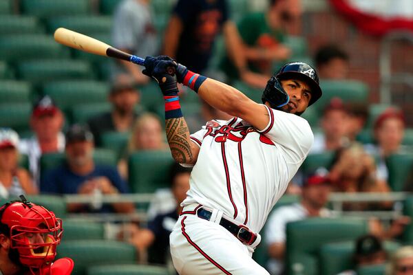 Atlanta Braves' Eddie Rosario hits a single during the third inning of a baseball game against the St. Louis Cardinals Monday, July 4, 2022, in Atlanta. (AP Photo/Butch Dill)