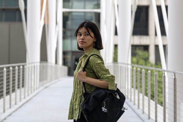 Angela Lim, who co-wrote a study about misinformation among Filipinos for a propaganda research lab at the University of Texas at Austin, walks across a bridge on the Austin, Texas, campus on June 21, 2024. (Photo by Eliana Alzate/News21)