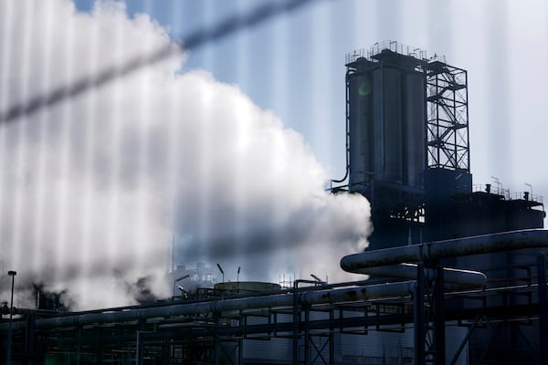 Steam and smoke in front of an industrial complex in the Port of Antwerp in Antwerp, Belgium, Wednesday, Feb. 26, 2025. (AP Photo/Virginia Mayo)